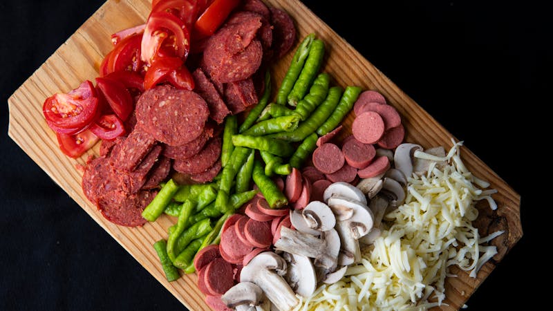 Freshly prepared pizza for a large catered group